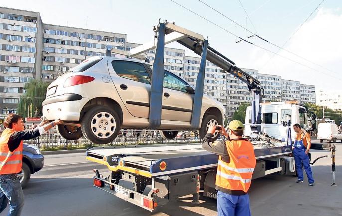 Hingherii de maşini se întorc. De sâmbătă, în Bucureşti, maşinile parcate ilegal vor fi ridicate! 