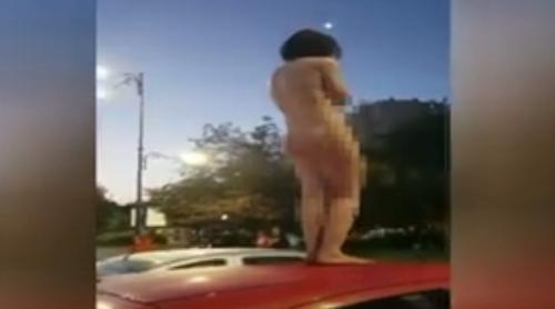 Ce a determinat o tânără să se dezbrace complet, pe o mașină, în centrul Capitalei (VIDEO) 